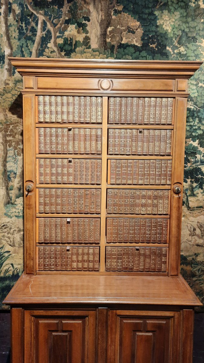 A Small Cabinet With Boxes Decorated With Books -photo-1