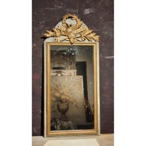 Trumeau de style Louis XVI en bois sculpté doré 