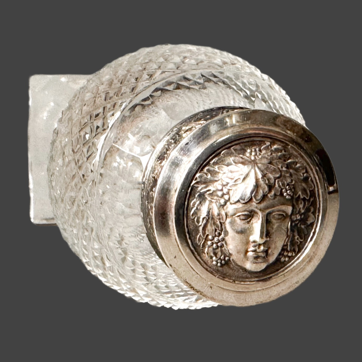 Silver Stopper Bottle With Head Of Dionysus And Vine Theme.