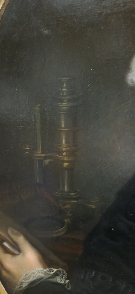 Portrait Of A Scientist With Microscope, Magnifying Glass And Books.  -photo-1