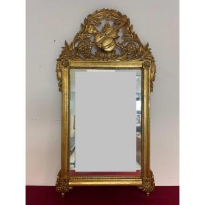 Miroir en bois sculpté et doré. Époque Empire toscane, première moitié du XIXe siècle.