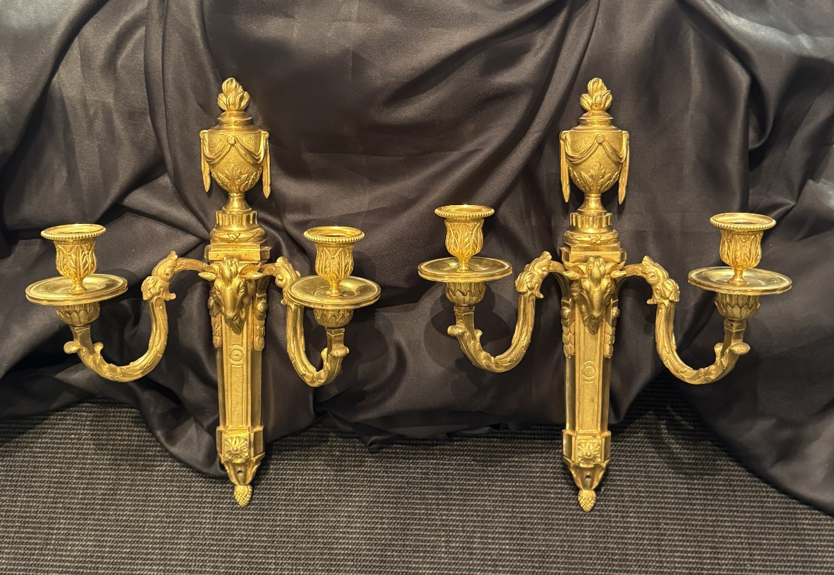Pair Of Louis XVI Period Two-light Sconces In Chased And Gilt Bronze