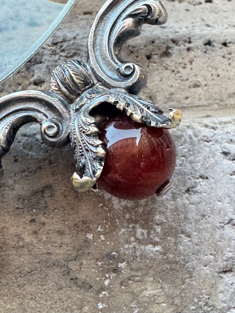 A Rare Example Of A Solid Silver Lens, Hand-chiseled With Masks Accented In Gold -photo-1