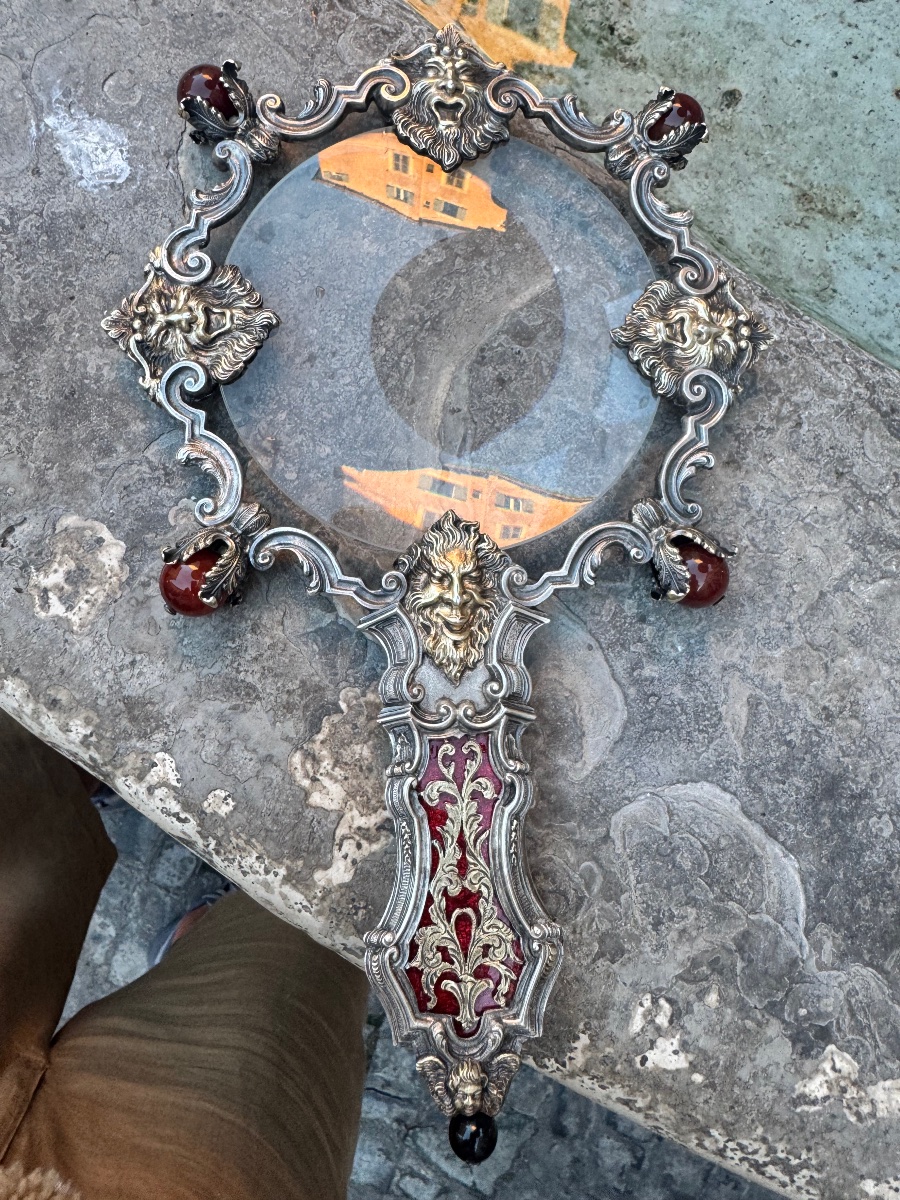 A Rare Example Of A Solid Silver Lens, Hand-chiseled With Masks Accented In Gold 
