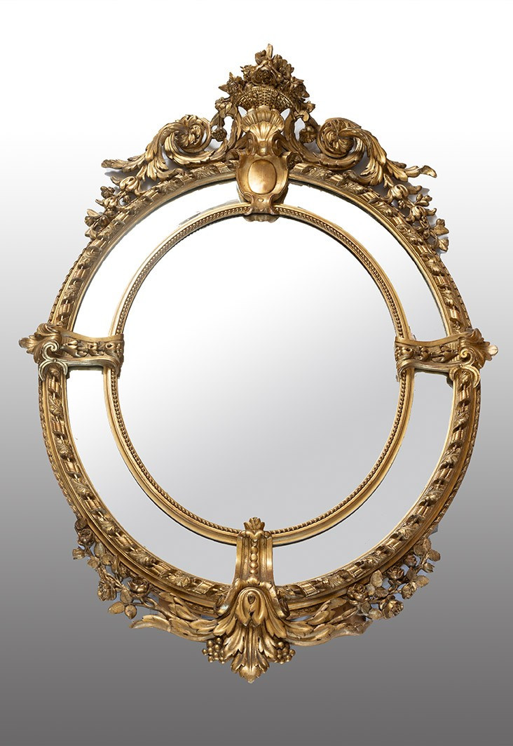 Miroir médaillon ancien Napoléon III en bois doré et sculpté. XIXe siècle.