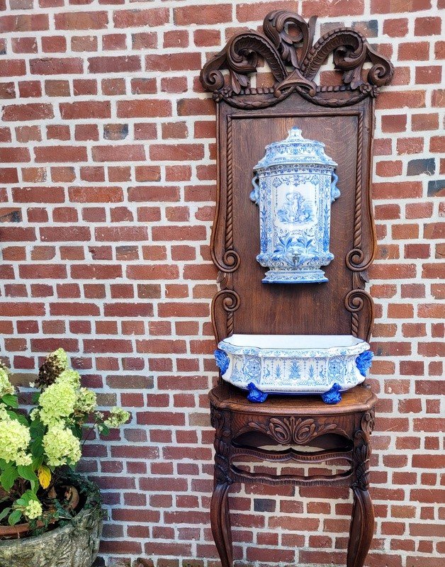 19th Century Gien Earthenware Fountain On Its Carved Wooden Support.
