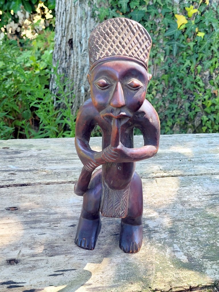 Wooden Statuette Depicting A Male Figure Smoking A Pipe—southwestern Congo.