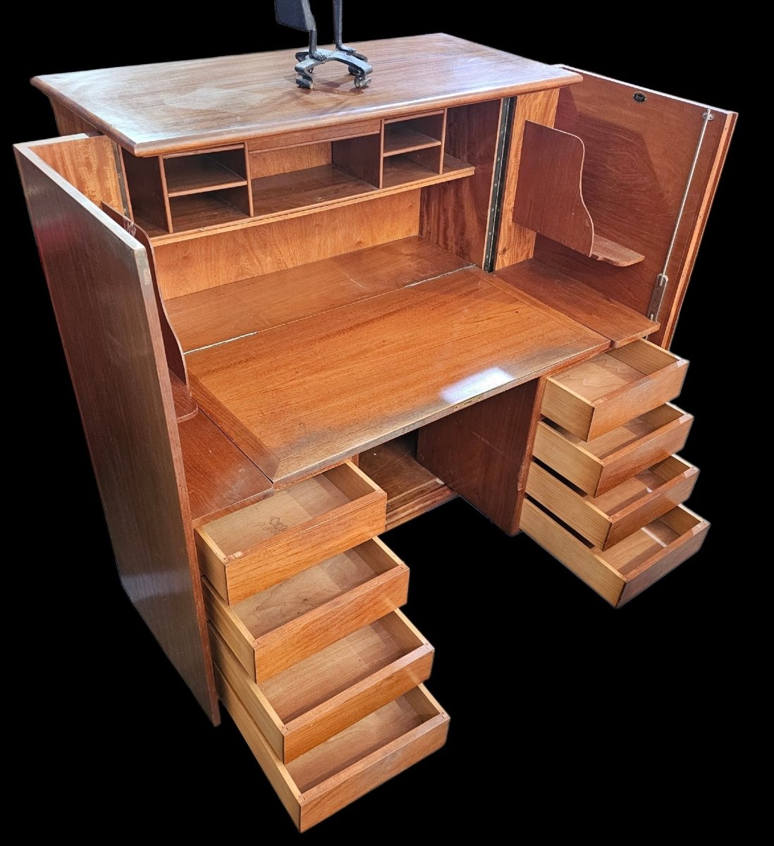 A Fold-away Desk Inside A Cabinet Known As A -photo-3