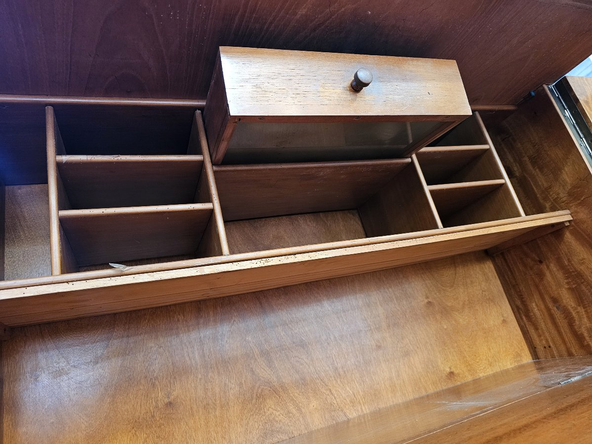 A Fold-away Desk Inside A Cabinet Known As A -photo-6