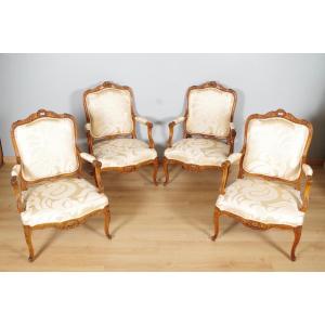 Suite de quatre fauteuils Régence à la Reine en hêtre sculpté, vers 1900
