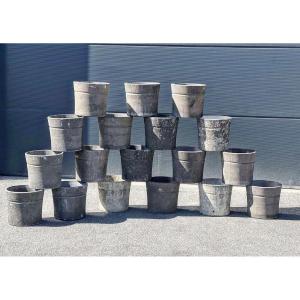 Series Of 18 Cement Vases 
