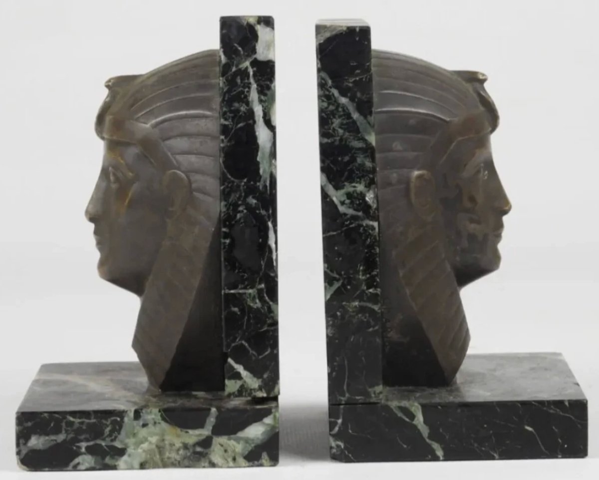 C. CHARLES Serre livres art déco bronze sur marbre représentant des visages de pharaon. Signés-photo-4