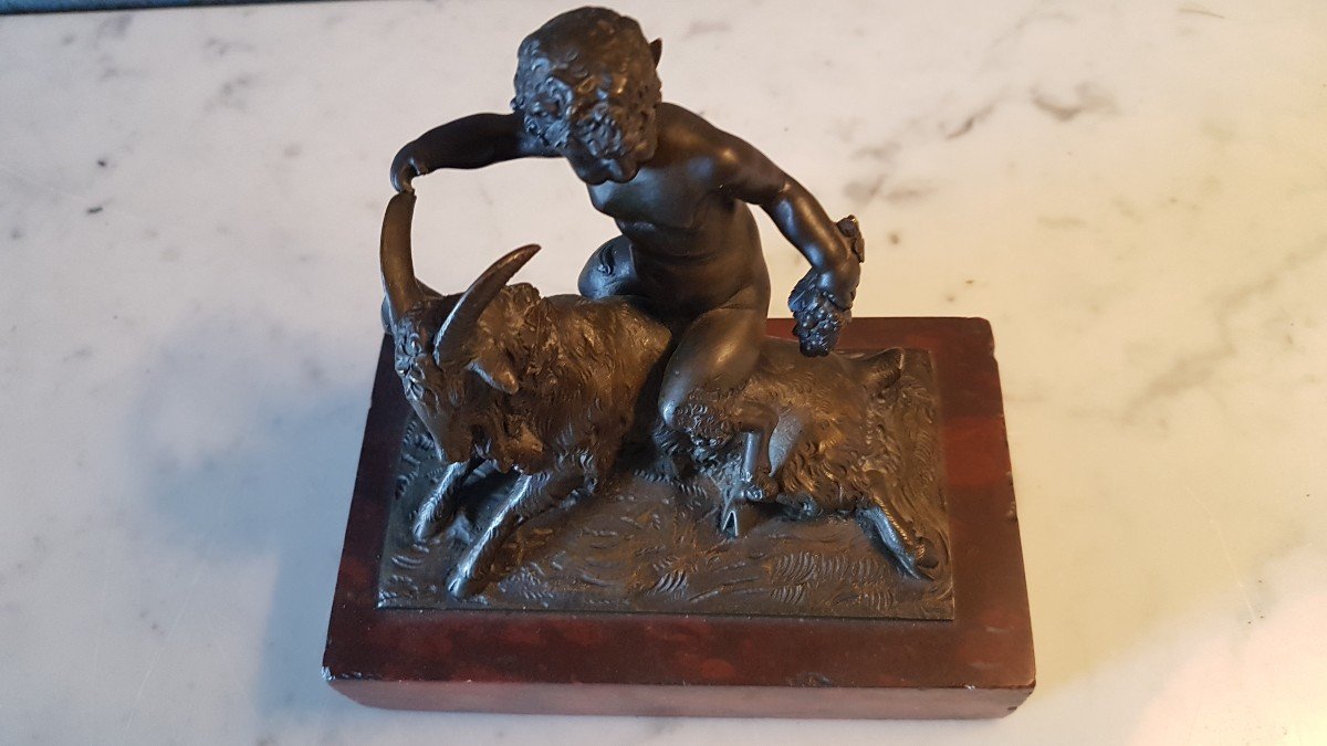 Bronze With A Red Marble Base. Representing A Satyr With A Goat.-photo-1