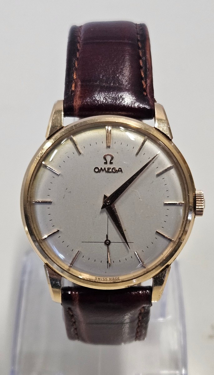 OMEGA, montre homme remontage manuel, or 18 k. 