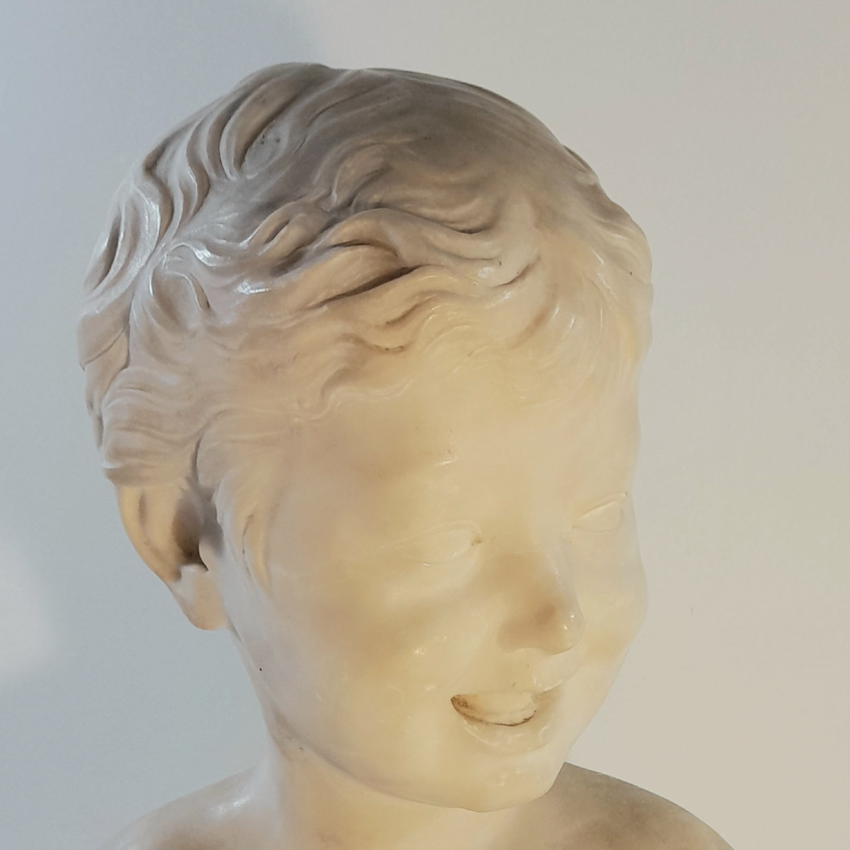Sculpture Of A Laughing Child's Bust In Alabaster.