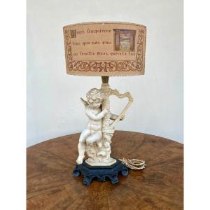 Lampe de table en bakélite cupidon jouant de la harpe 1940