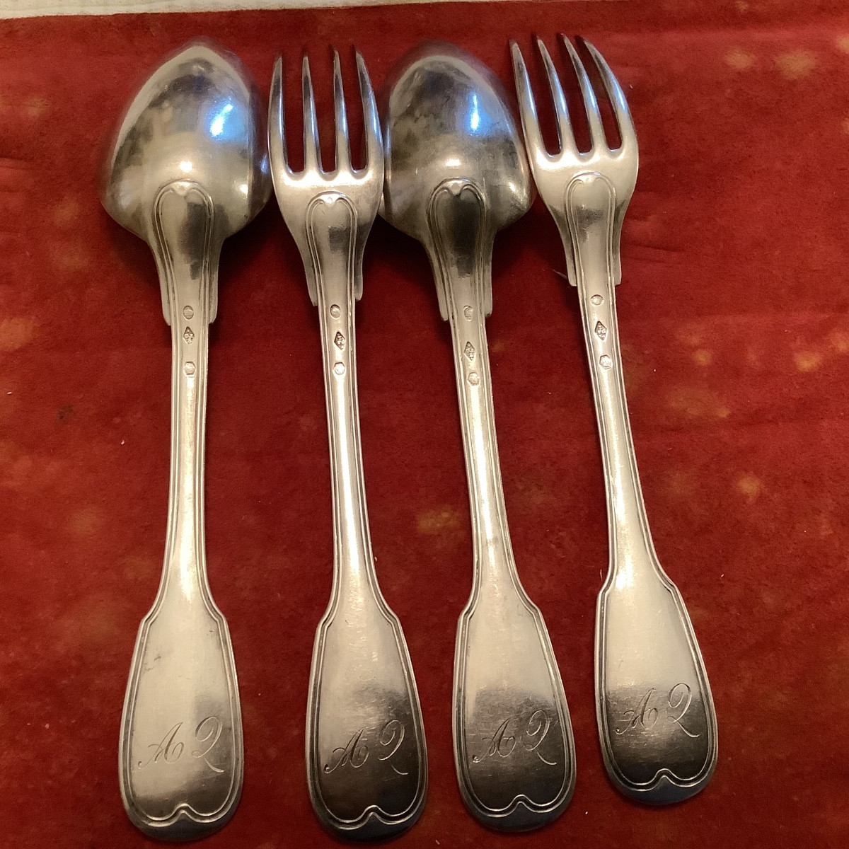 Série de 2 couverts au filet en argent massif 