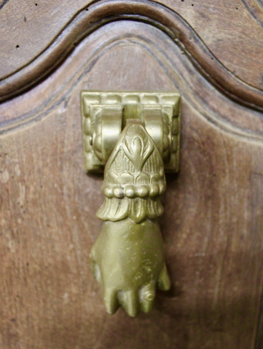 Heurtoir en bronze plein, forme de main, XIXème