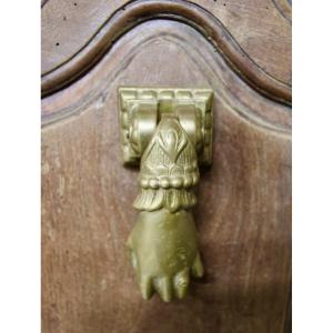 Heurtoir en bronze plein, forme de main, XIXème