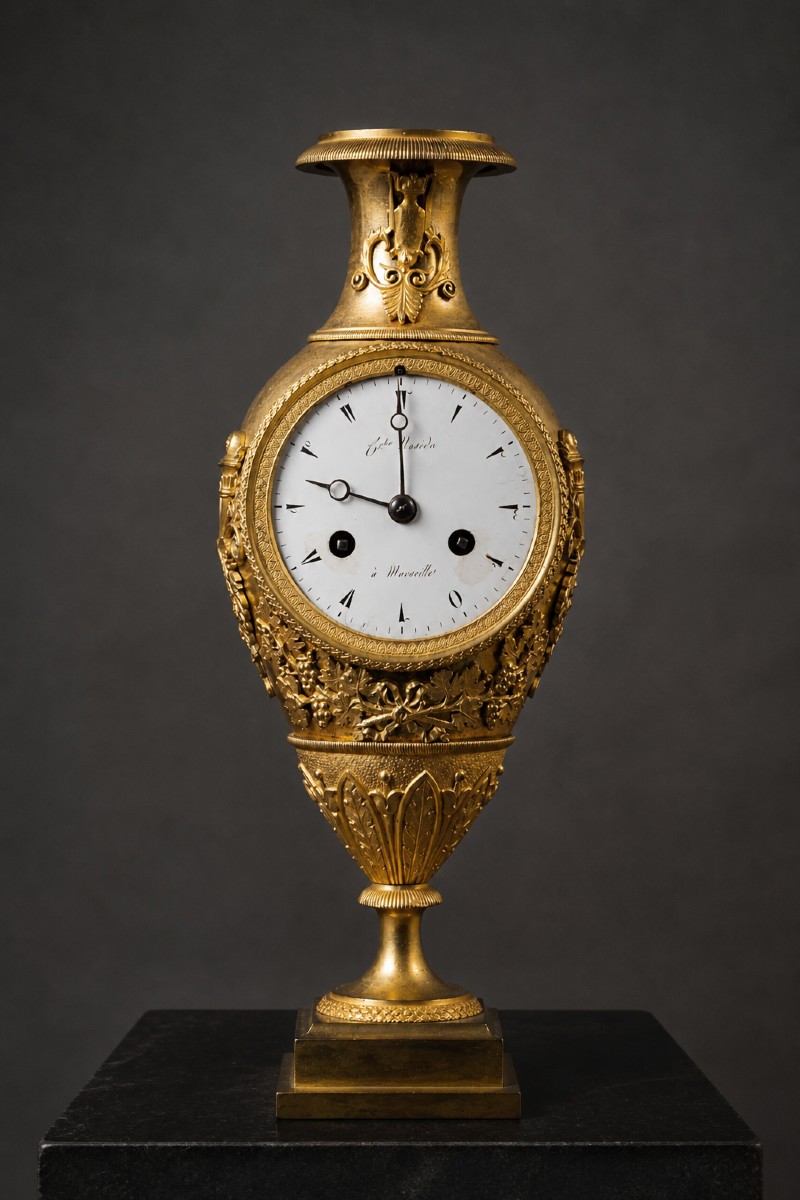 Gilded Bronze Pendulum Clock Decorated With Leaves And Vine Shoots. Empire 19th Century
