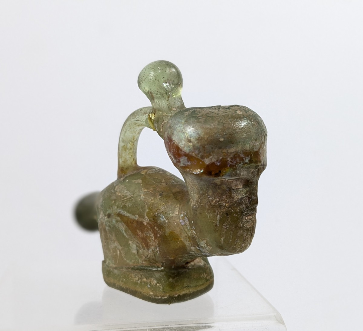 Anthropomorphic Amulet In Blown Glass, Medieval Iran. 