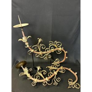 A Pair Of Wall-mounted Candle Holders In Iron