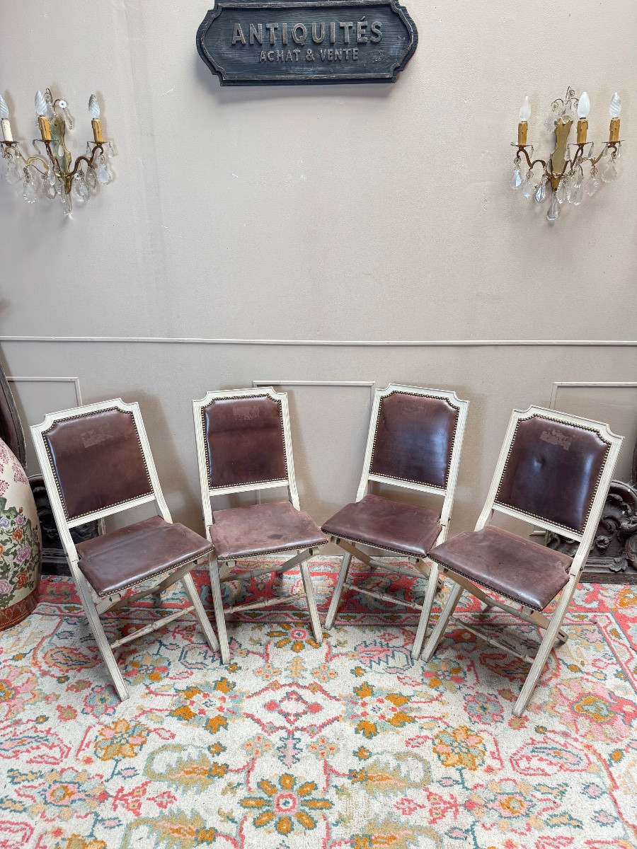 Suite de quatre chaises pliantes en bois laqué de style Louis XVI -photo-1