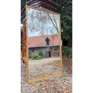 Miroir en bois et stuc doré de style Louis XVI 