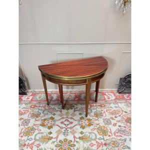 Table demi lune formant console et table de salle à manger en acajou de style Louis XVI.