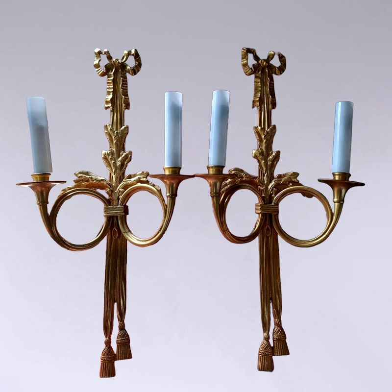 A Pair Of Electrified Bronze Wall Sconces.