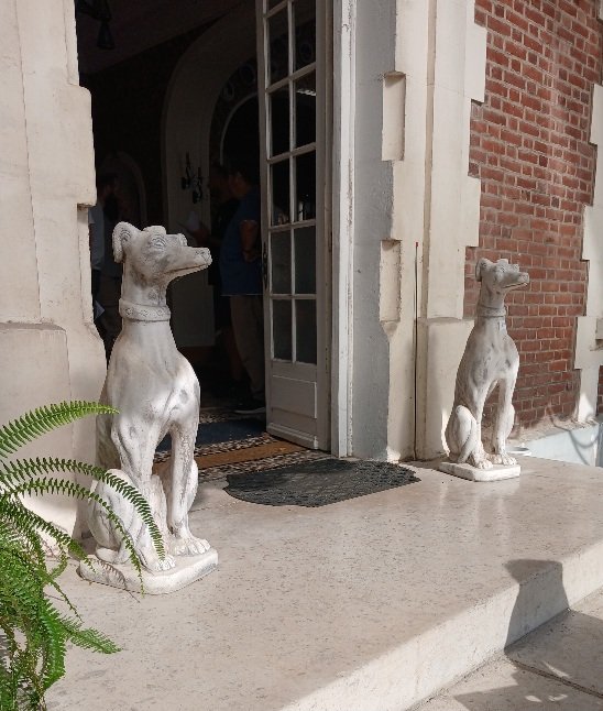 An Elegant Pair Of Cement Greyhounds