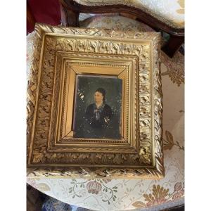 Paire de cadre dorés avec portraits 