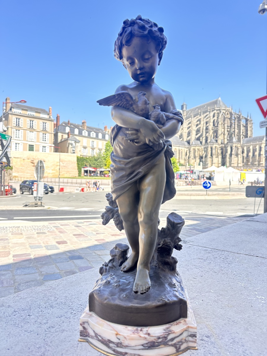 Bronze enfant aux oiseaux