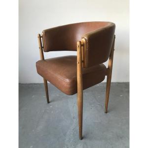 Armchair In Brown Leatherette Around 1950.