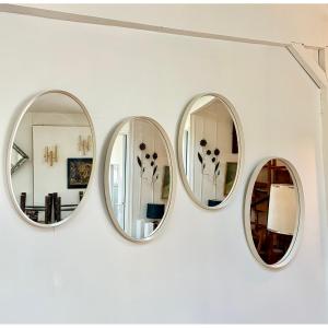 Set Of 4 Oval Mirrors Made Of White-lacquered Wood, Circa 1970.