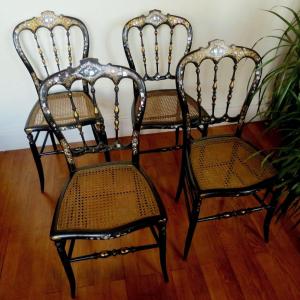 Suite de quatre chaises Napoléon III, en bois noirci et incrustations de nacr