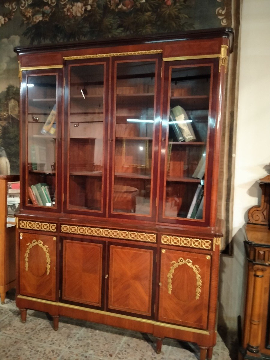 Beautiful And Elegant Bookcase With Four Glass Doors At The Top And Four Closed Doors -photo-2
