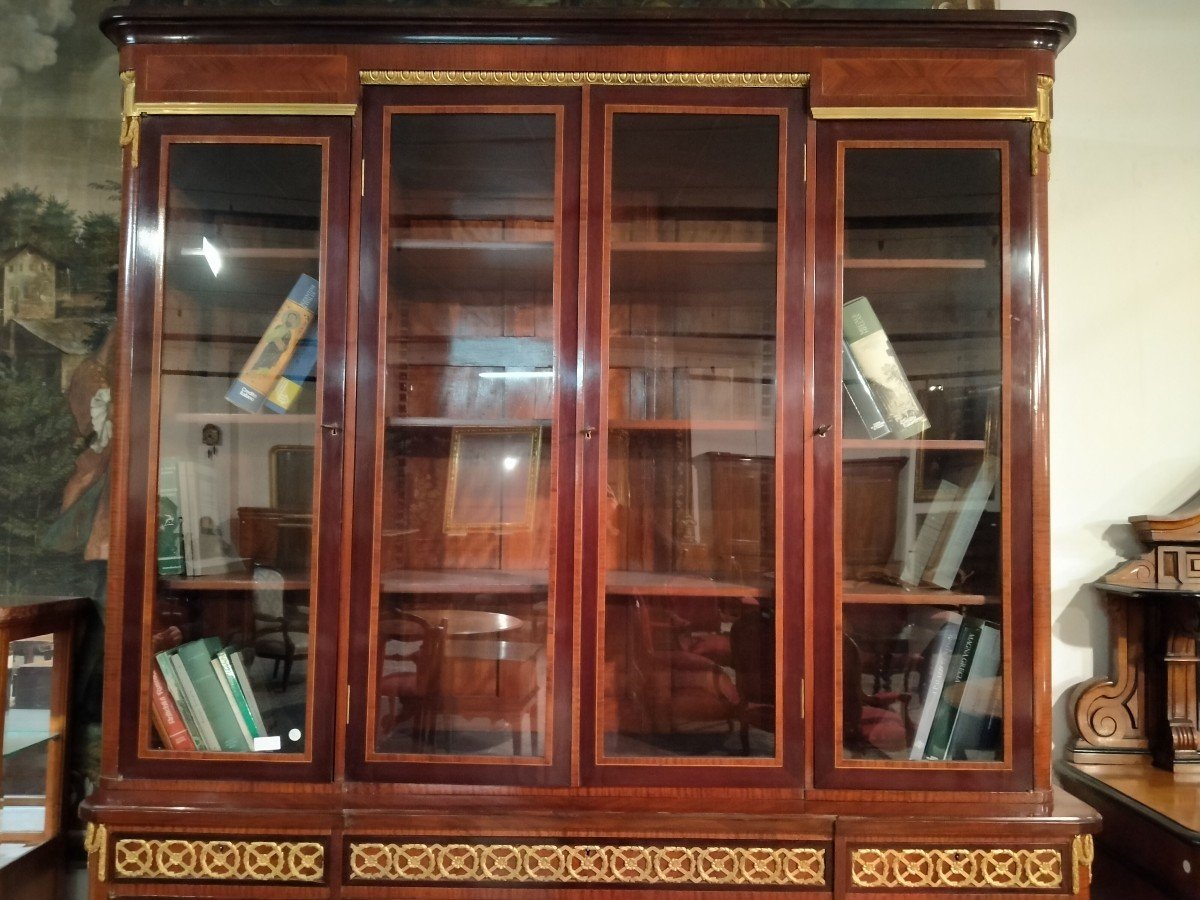 Beautiful And Elegant Bookcase With Four Glass Doors At The Top And Four Closed Doors -photo-1