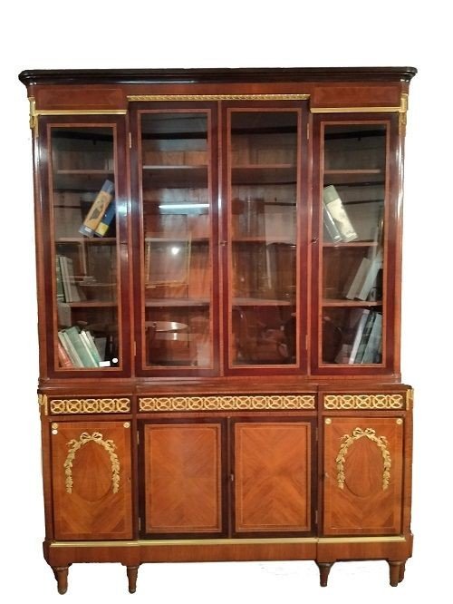 Beautiful And Elegant Bookcase With Four Glass Doors At The Top And Four Closed Doors 