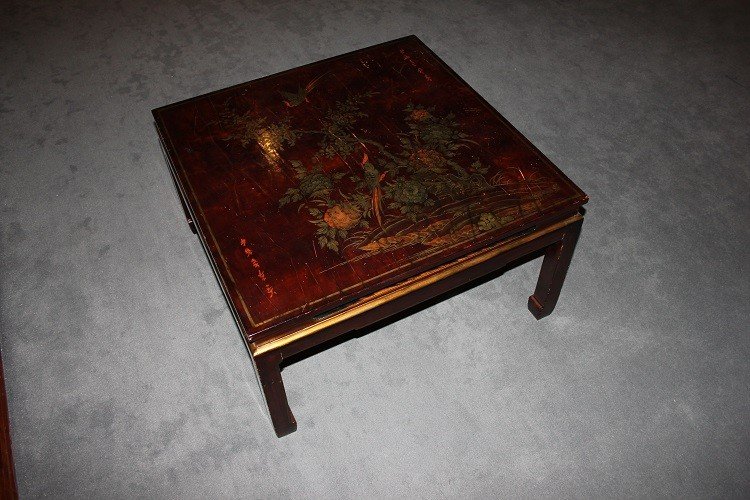 Low Chinese Coffee Table From The Early 1900s, Lacquered Wood. It Features A Top Decorated 