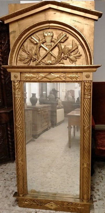 Mirror In Carved And Gilded Wood. There Are Side Columns While The Rich Coping Is Adorned With 