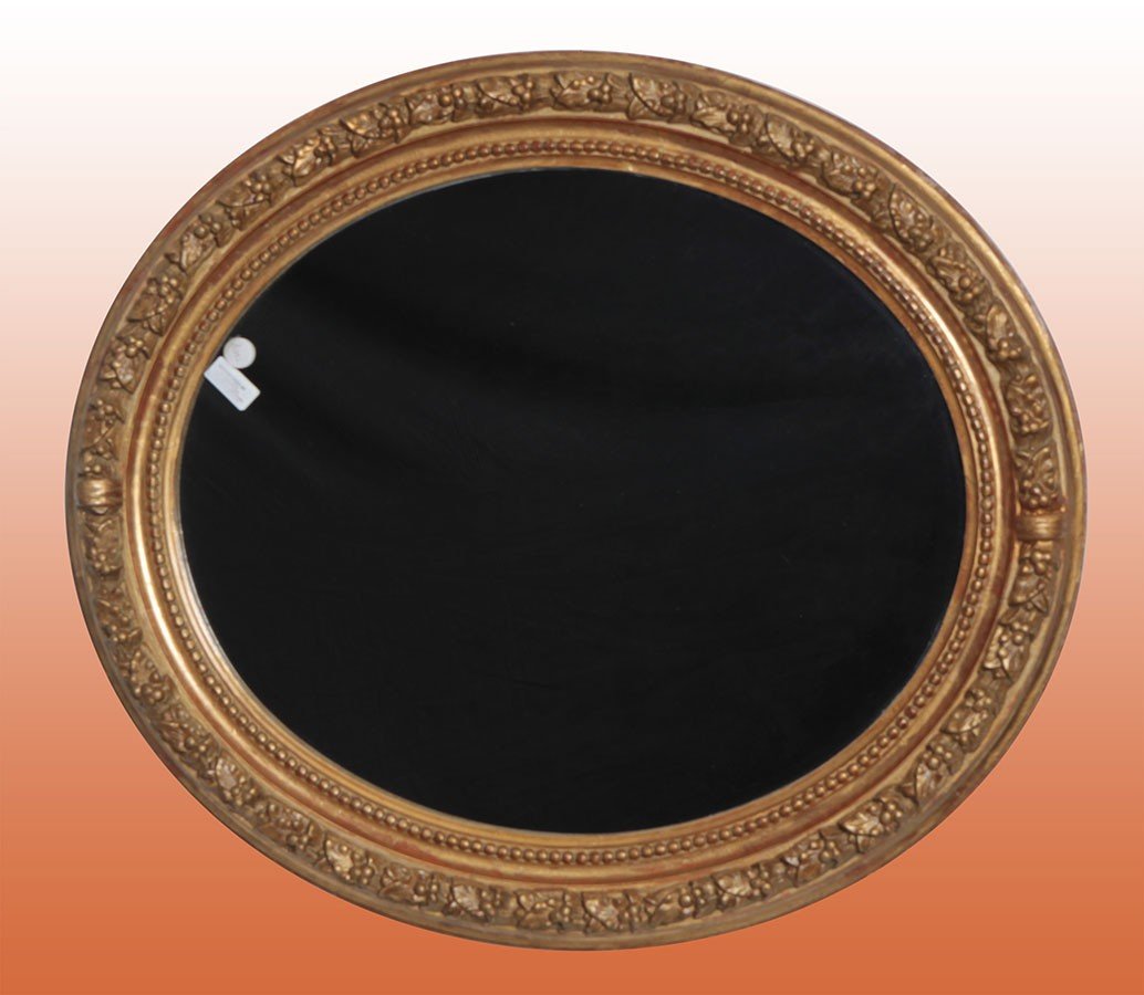 Late 19th-century French Oval Mirror With Intarsia Carvings.  Origin: France  Period: 