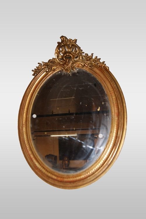 Oval French Gilded Mirror With A Cornice