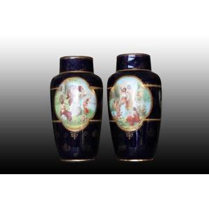 A Pair Of Austrian Vases From The Vienna Manufactory, Made Of Porcelain, Featuring Scenes In A 