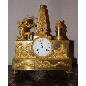 Empire Table Clock, French, From The First Half Of 1800 Entirely In Gilded Bronze With Mercury.