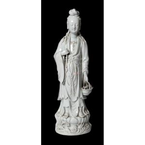 Chinese White Porcelain Sculpture From The Late 1800s Of A Young Woman Holding A Basket With 