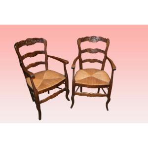 Paire de fauteuils provençaux fin 19ème siècle en bois de chêne sculpté