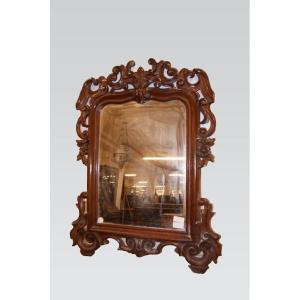 Miroir de style Louis Philippe en bois d'acajou richement sculpté