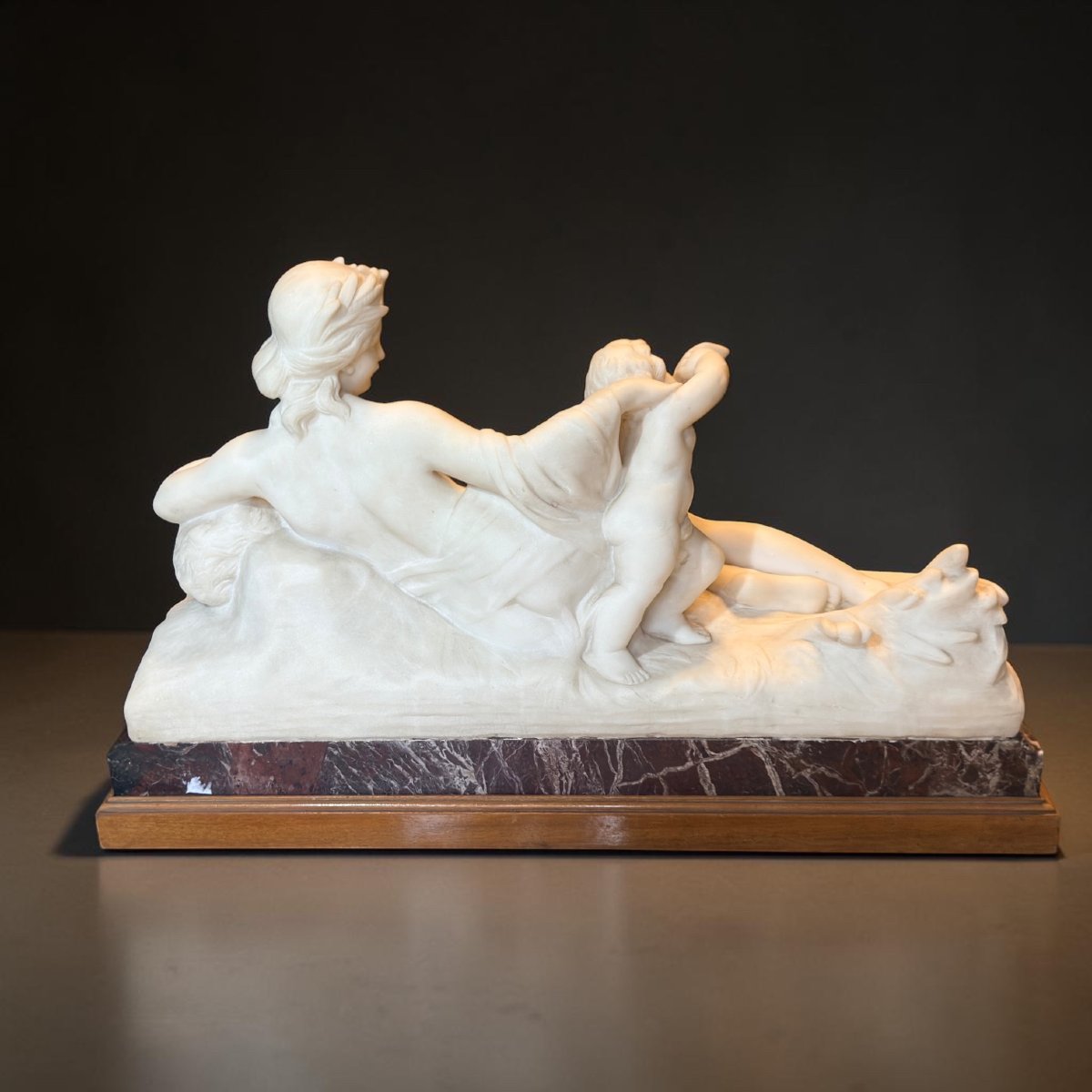Statue Depicting A Young Girl With A Reclining Cherub, White Carrara Marble -photo-3