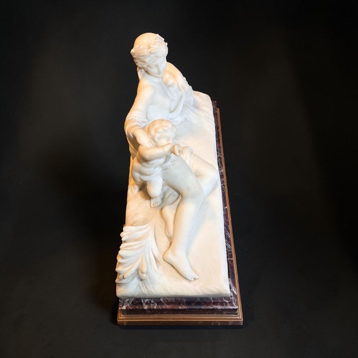 Statue Depicting A Young Girl With A Reclining Cherub, White Carrara Marble -photo-7